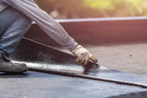 Professional Basement Waterproofing technician working in New Liberty, KY